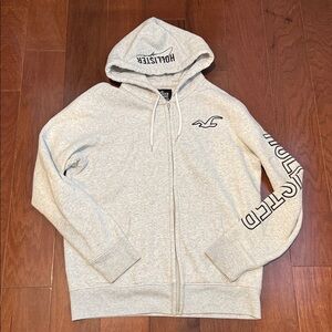 Hollister Gray Zip-Up Hoodie men’s large logo and words are black stitching